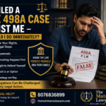 Distressed husband reviewing a false 498A FIR while consulting legal options, with legal symbols representing CAW Cell proceedings, anticipatory bail, and defence against false dowry harassment allegations.