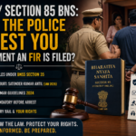 Police officer detaining a man outside a residence while legal graphics highlight Section 85 BNS, BNSS Section 35 arrest rules, anticipatory bail rights, and Supreme Court guidelines regarding arrest after a 498A FIR in India.